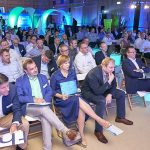 Audience listening during a conference event.